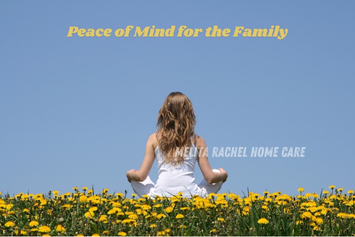 Woman meditating peacefully in a field of yellow flowers – Peace of mind with home care support by Melita Rachel Home Care Services in Pollachi